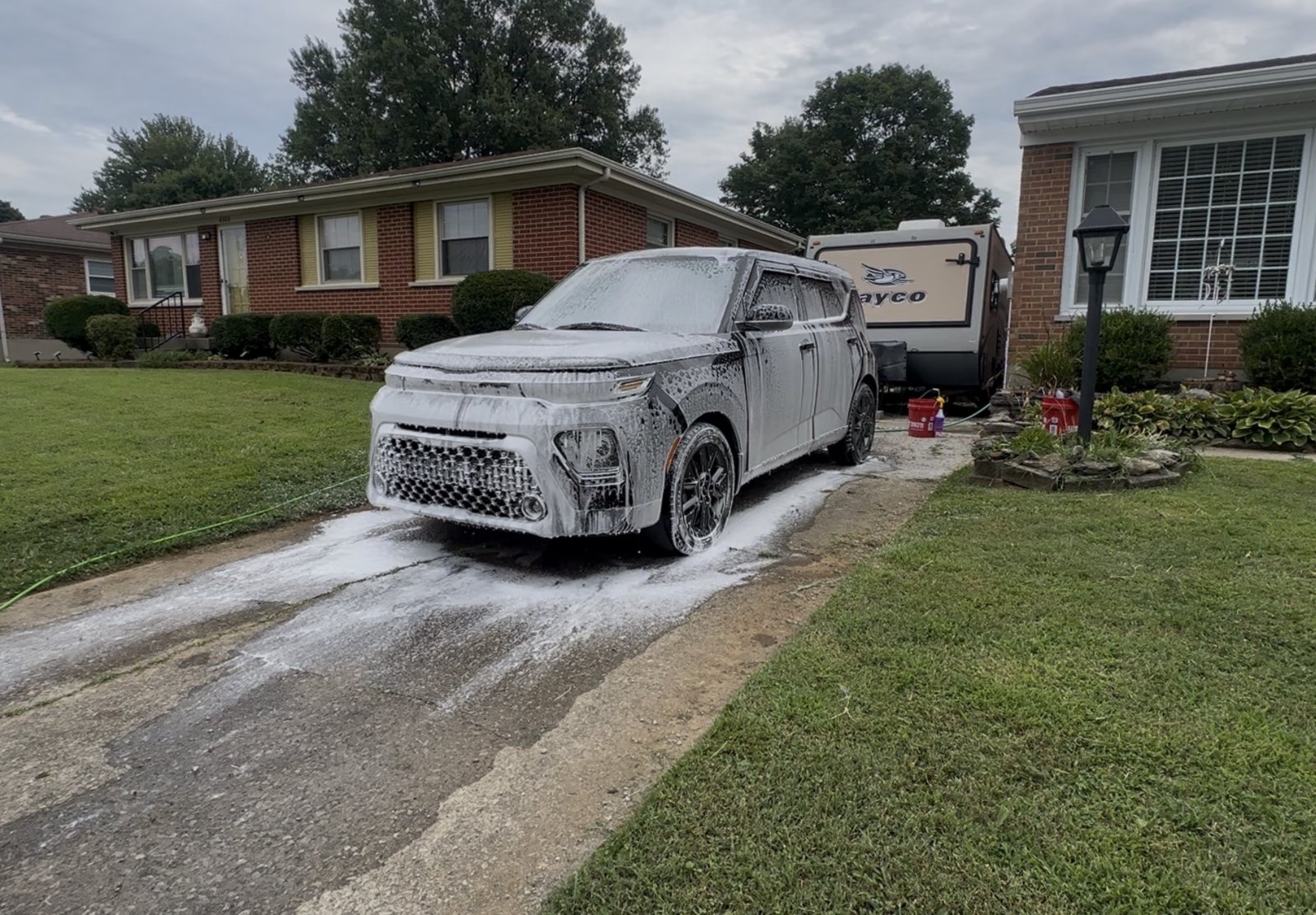 Kia Soul covered in snow foam